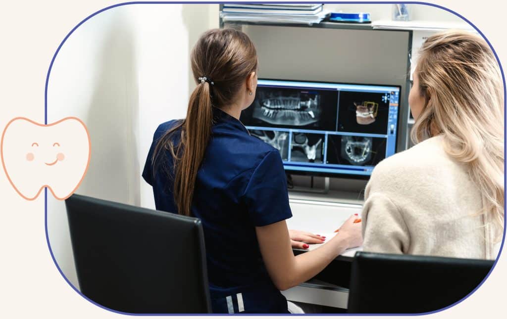 Drs. Uyen Pham & Giang Pham examining dental xrays