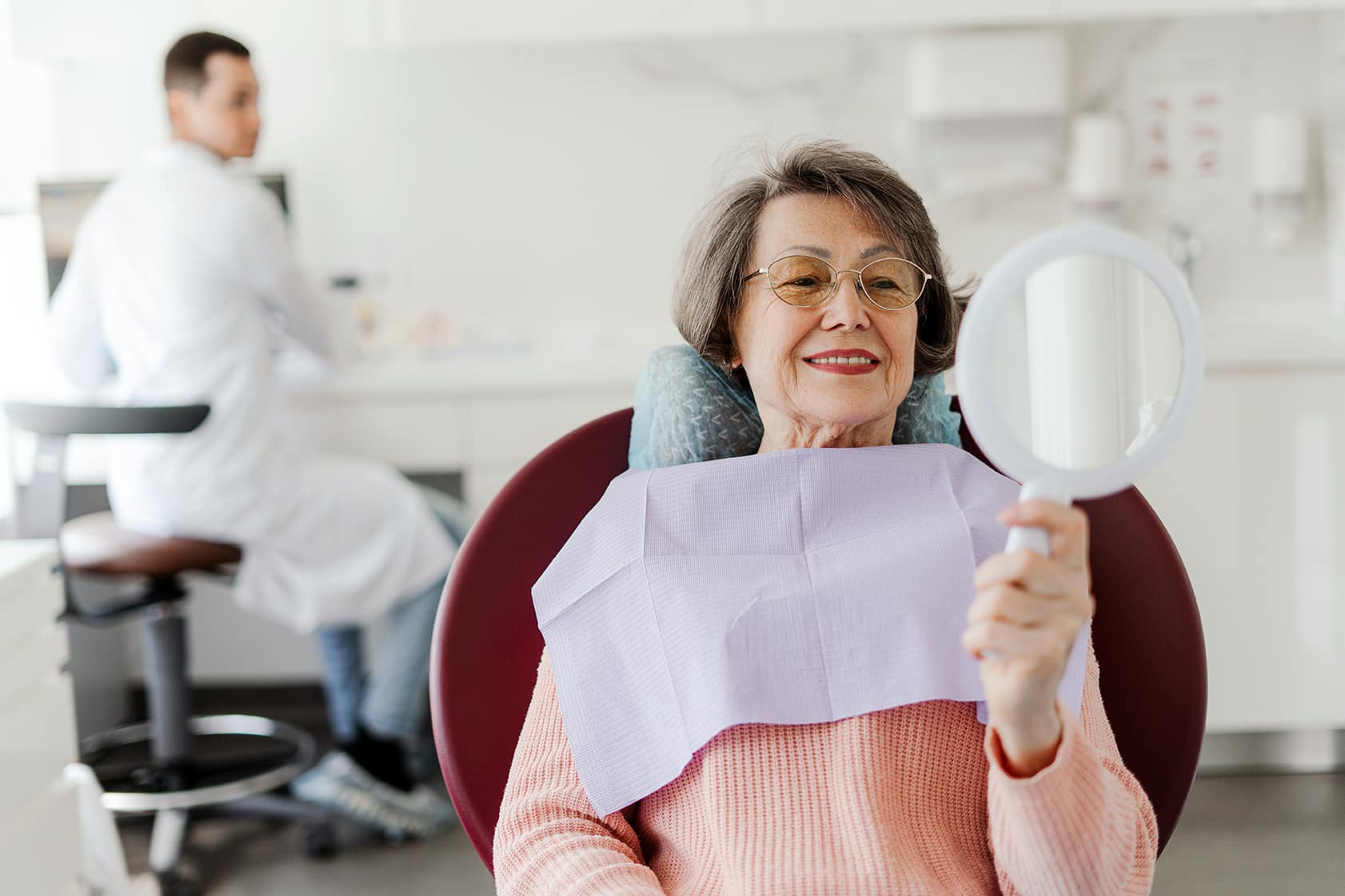 woman sitting in a dental chair at inspired smiles dental office