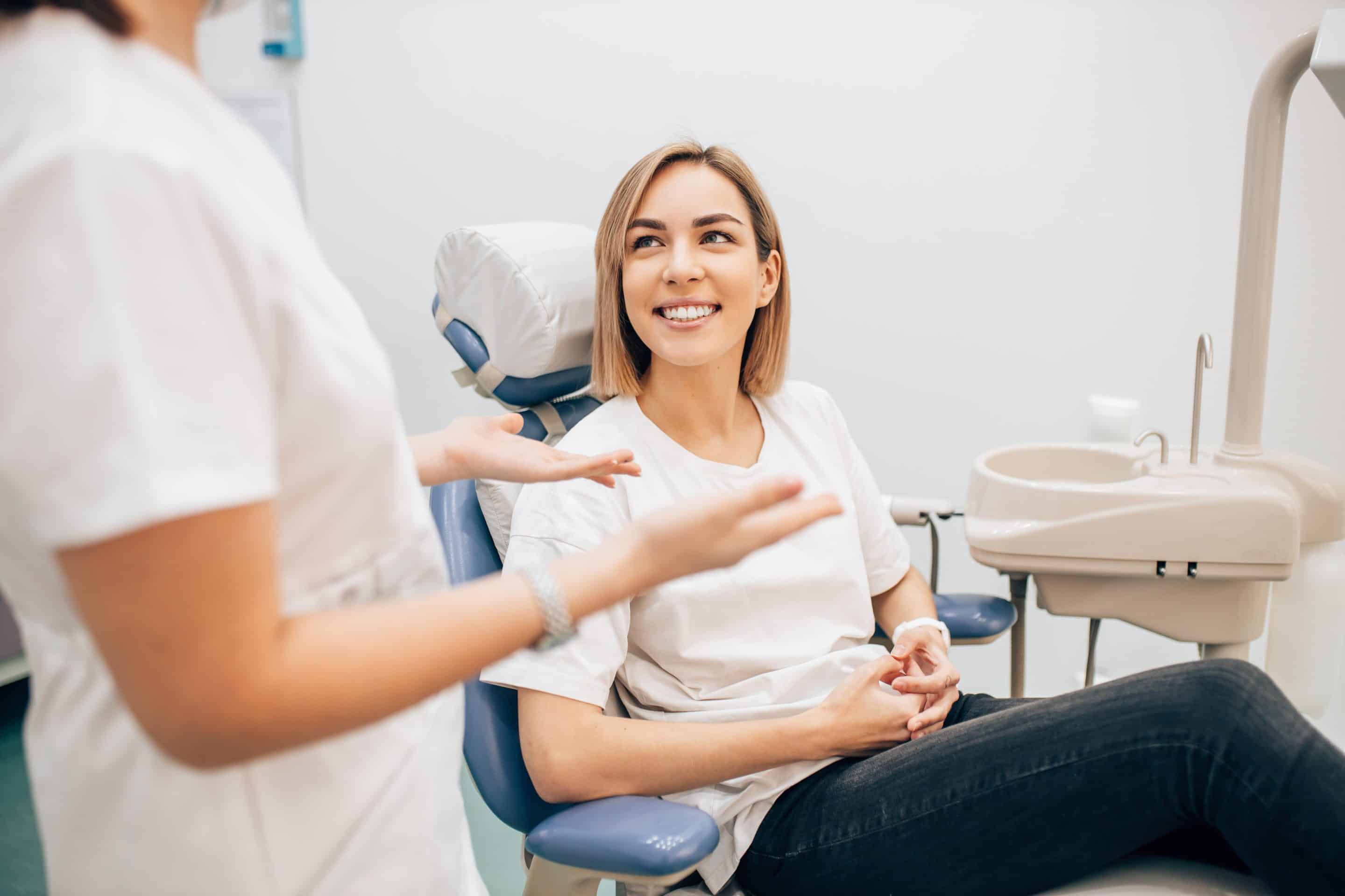 dental patient smiling during dental cavity filling appointment at inspired smiles