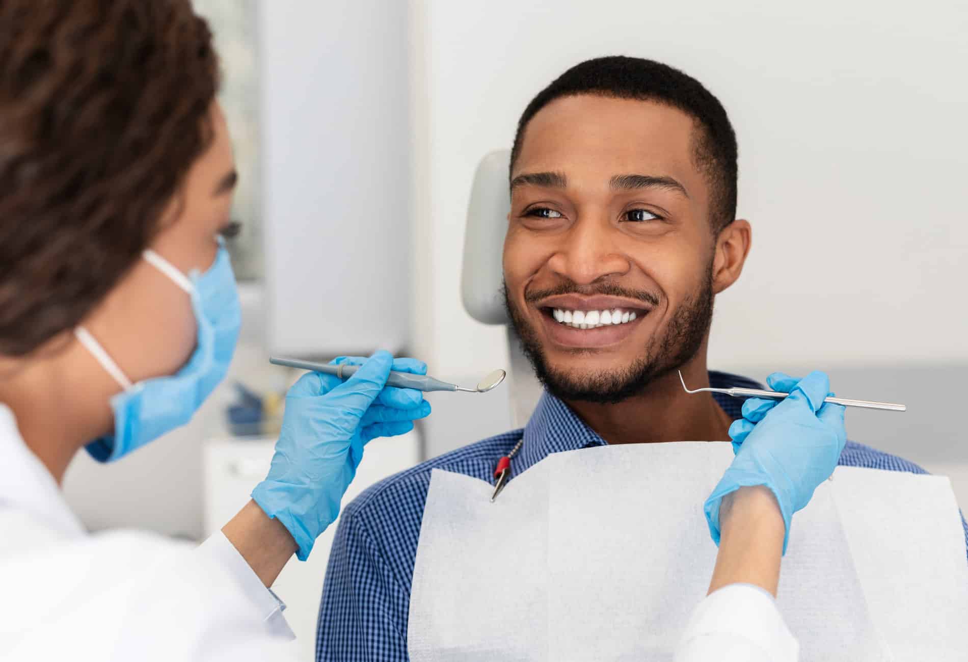 Man smiling at his rool canal therapy appointment in Burnsville MN